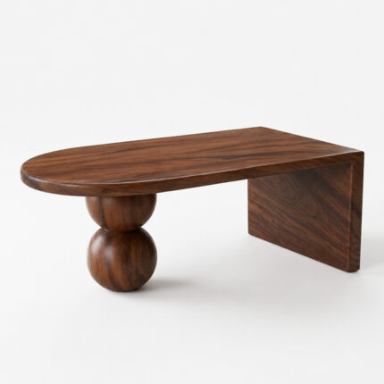 Modern oval coffee table crafted from dark Suar wood, showcasing rich grain patterns, double-ball leg support, and a distinctive waterfall side