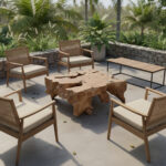 Rania Teak Root Coffee Table rectangular design styled in an outdoor tropical patio with teak chairs, natural stone wall, and lush greenery surroundings.