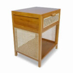 Liem Square Bedside Table made of solid teak wood with a natural finish, featuring a rattan drawer and open shelf, side perspective view