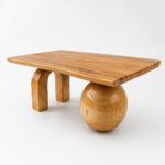 Live Edge Suar Wood Coffee Table featuring a unique sphere and arch leg design with a natural finish