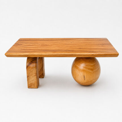 Modern suar wood coffee table with sphere base and arch legs natural finish