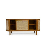 Minimalist Nala sideboard featuring natural blonde teak wood and light rattan sliding doors in a curved mid-century design