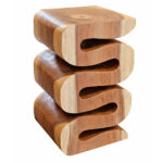 A Serpentine Suar Wood Stool featuring a solid wood sculptural S-shape design with natural wood grain patterns and a clean studio white background