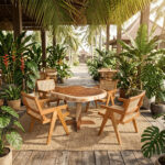 Solara live edge cafe table with teak wood chairs featuring rattan seat and backrest design in tropical outdoor setting