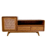 Front view of Sora Split Level Teak Credenza made from solid teak wood with natural rattan sliding door, open shelf, and two storage drawers in mid-century modern style.