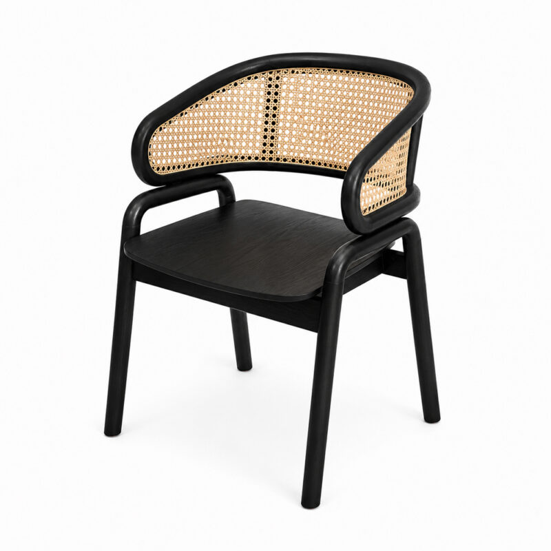 A three-quarter view of the Nara Teak Rattan Wave Chair in a black finish, showcasing its unique curved cane backrest, smooth wooden seat, and slender legs against a plain white background. The intricate weave of the natural rattan is clearly visible