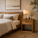 Aura solid teak bedside table with drawer beside bed in modern bedroom interior