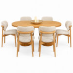 Solid teak oval dining table with fluted pedestal base and upholstered teak dining chairs front view