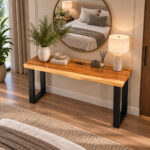 Forge live edge suar wood console table showing natural slab top and black iron base