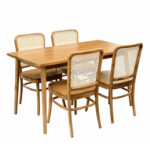 Solid teak wood dining table with four natural rattan Kevin chairs for restaurant and hotel