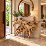 Natural teak root console table styled in a modern tropical villa entrance interior