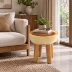 Natura organic suar wood side table styled beside lounge sofa with natural decor