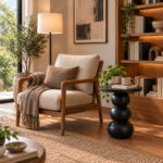 Orbella black sculptural side table beside lounge chair