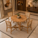 Orion round teak dining table with chairs in modern dining interior