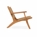 Solid teak woven lounge chair with mid-century design side angle