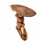 Live edge suar wood console table showing natural grain and sculptural base
