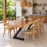 Live edge Suar wood dining table styled with wooden dining chairs in a modern tropical interior