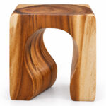 ArcoForm solid Suar wood stool with sculptural curved opening