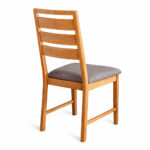 Back view of Arsy teak dining chair with horizontal wooden slats and grey cushion