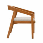 Side view of solid Suar wood dining armchair highlighting its angular frame and upholstered seat