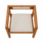 Top view of Artika solid Suar wood armchair showing the upholstered seat and integrated wooden armrests