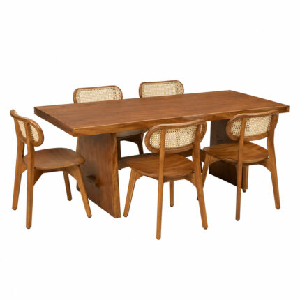 Artisan solid Suar wood dining table paired with teak wood dining chairs featuring woven rattan backrests