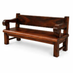 Three-Quarter Product View: Bagong Suar Wood Bench with sculpted armrests, full wooden backrest, and rich brown Suar wood grain