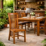 Balero solid teak wood dining chair with high slatted backrest in a dining room