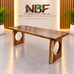 Circular cut-out Suar wood dining table displayed in the Niwara Bisoepo Furniture studio