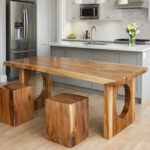 Sculptural solid wood dining table with circular openings in a minimalist dining room