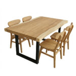 Suar wood dining table with natural edges and black metal legs shown before final wood finishing