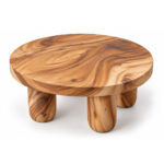 Three-quarter view of the Grainora coffee table highlighting its thick round top and rounded legs