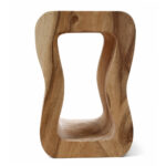 Lenggok natural Suar wood stool front view with organic sculptural shape
