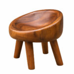 Side view showing the sculptural form of the Suar wood lounge chair