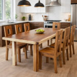 Nico Rect Suar wood dining table paired with wooden dining chairs in a bright minimalist dining room