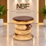 Nuvora round Suar wood accent table displayed in the NBF furniture studio