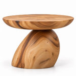 Orvella Suar wood side table with a round top and organic sculptural pedestal