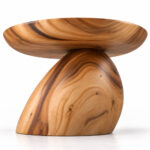 Underside view of the Orvella side table showing its curved top and pedestal base