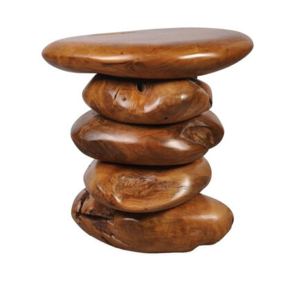 Three-quarter view of a sculptural solid Suar wood accent table with rounded stacked forms