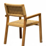 Back view of solid teak wood chair showing the woven backrest and wooden frame