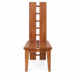 Solid Suar wood H-design dining chairs arranged around a wooden dining table in a bright dining room