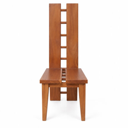 Solid Suar wood H-design dining chairs arranged around a wooden dining table in a bright dining room