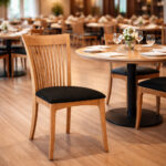Full view of solid teak wood dining chair with upholstered foam seat