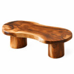 Suar Flow solid Suar wood coffee table with organic curved tabletop and cylindrical legs