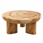 Close-up of the rounded Suar wood tabletop edge and distinctive three-leg base of the Suarora Triform coffee table