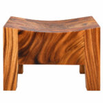 Front view of Suarvo Suar wood stool highlighting its curved seat and sturdy geometric profile