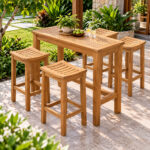 Solid teak outdoor bar chairs around high bar table on patio