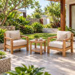 Solid teak patio accent table with lower shelf in outdoor garden setting