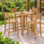 Teak outdoor bar chairs with slatted curved backrest in garden
