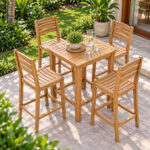 Teak slatted outdoor bar chairs around patio table